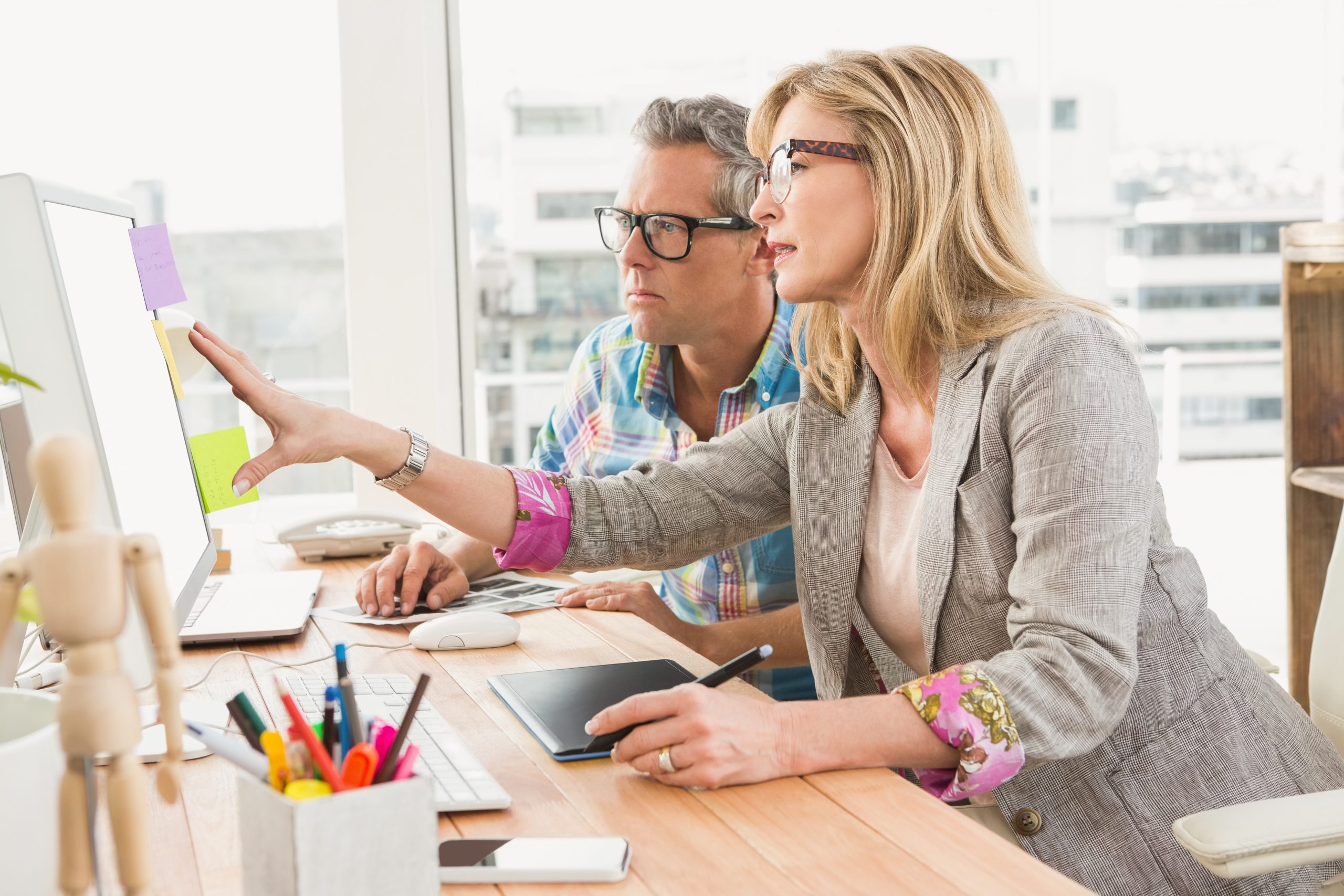 creative design team working together on computer in the office